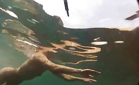 guy with underwater cam follows around women on nudist beach